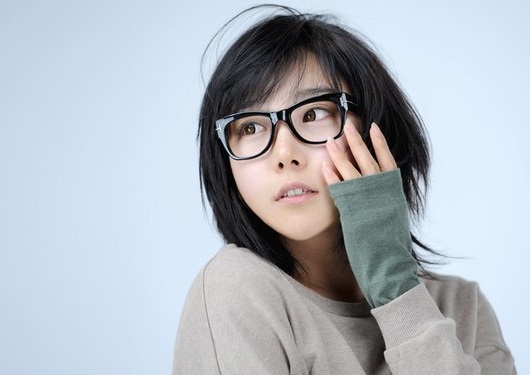 Image of Blunt bob with side-swept bangs oval face glasses